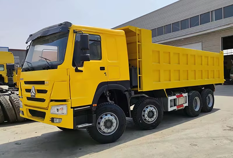 Gebruikte Howo Dump Truck 371pk 8x4 Linksgestuurde Diesel WP Motor AC 12 Wielen voor Zimbabwe